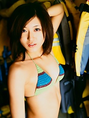Lovely asian hottie is enthralling in her little bikini